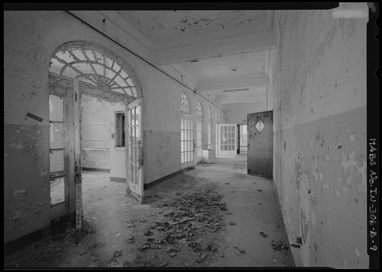 A hospital nurses' station at the end of a long corridor