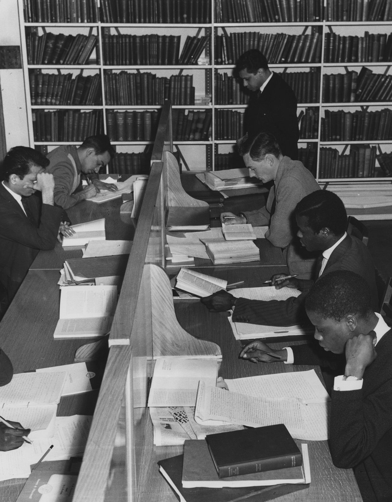 Readers at the desks of an international law reading room, 1964